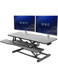Elevador de Escritorio Ajustable para Trabajo Sentado o De Pie con Espacio para Monitor y Portatil
